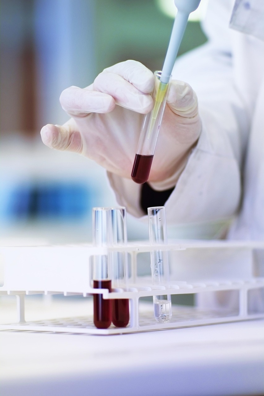 Person holding a blood sample test tube for accurate DNA testing and forensic genetic analysis at DNA Forensics Test Solutions.