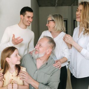 A joyful family gathering indoors and doing Parentage DNA test by DNA Test Solutions