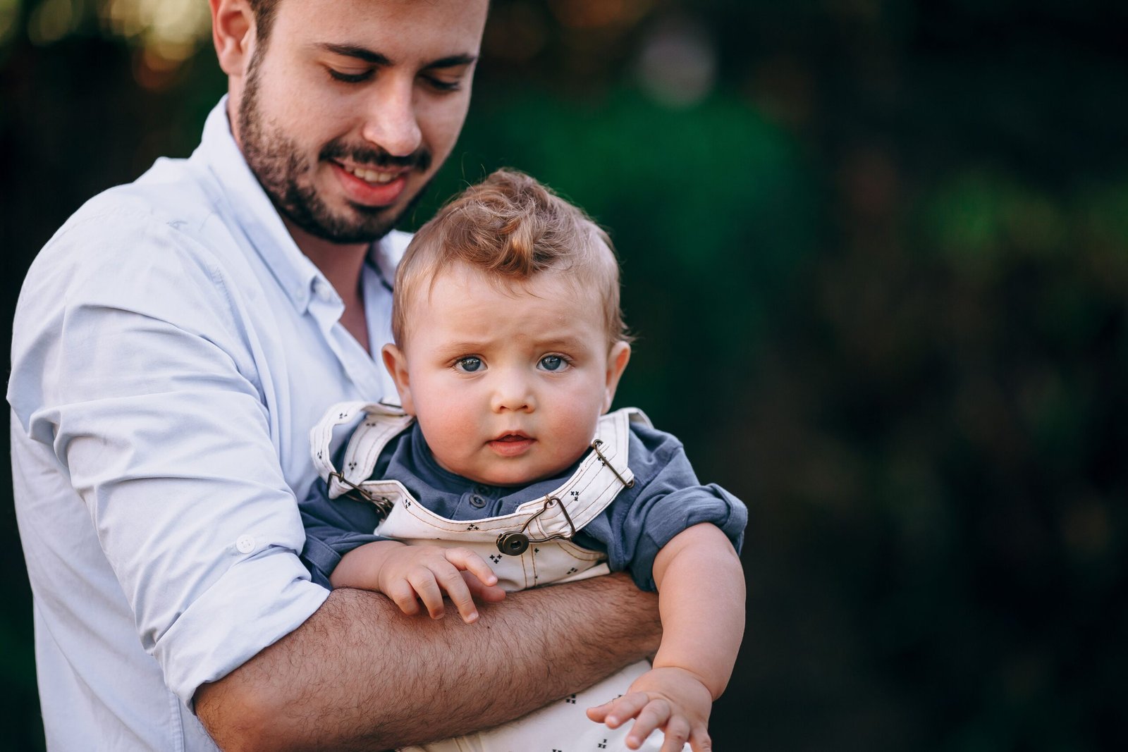 A father holds his baby boy sharing a joyful moment together and ready for Paternity DNA Test For Peace Of Mind by EVIDEXA DNA Test Solution