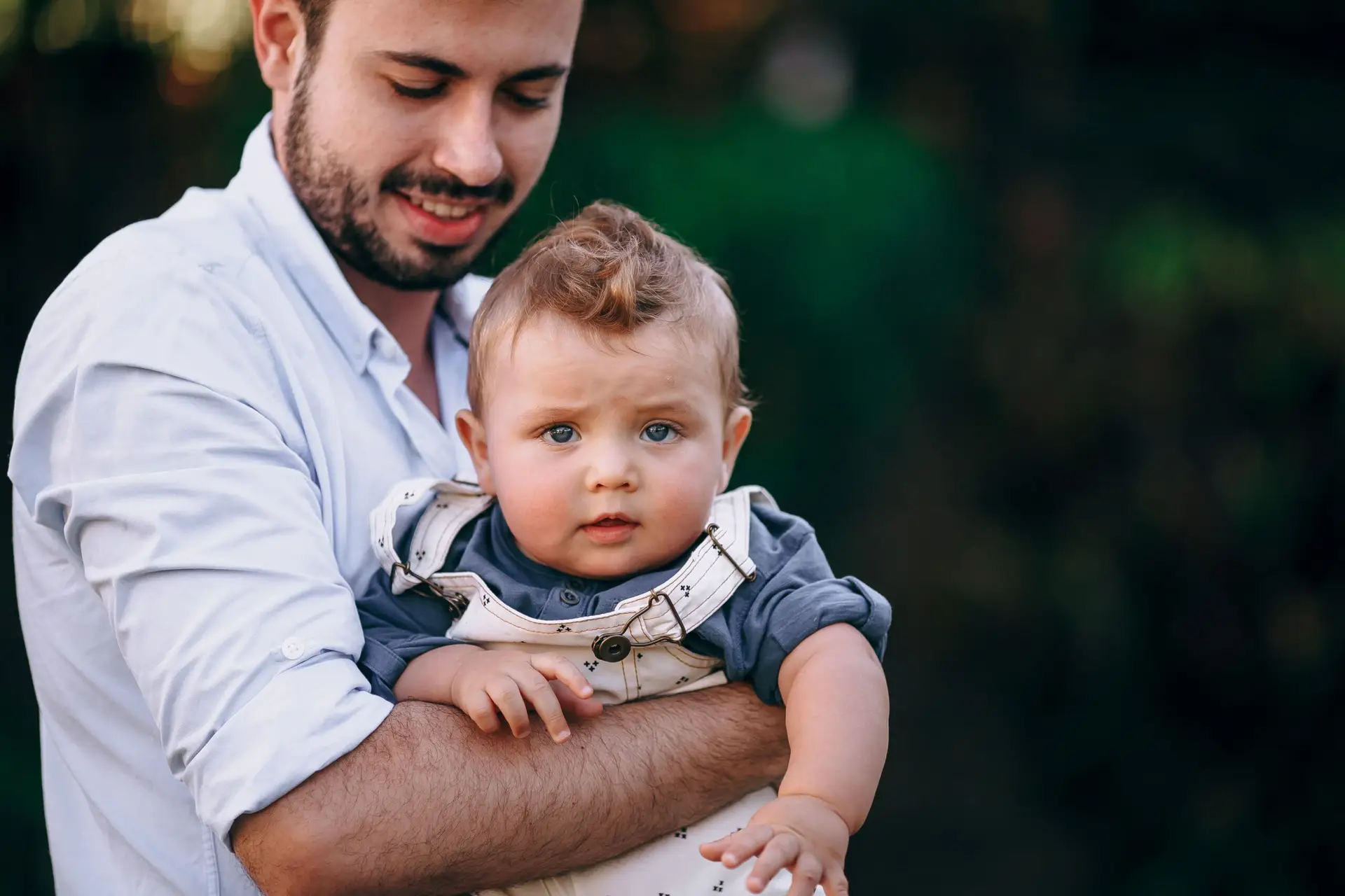 A father holds his baby boy sharing a joyful moment together and ready for Paternity DNA Test For Peace Of Mind by EVIDEXA DNA Test Solution