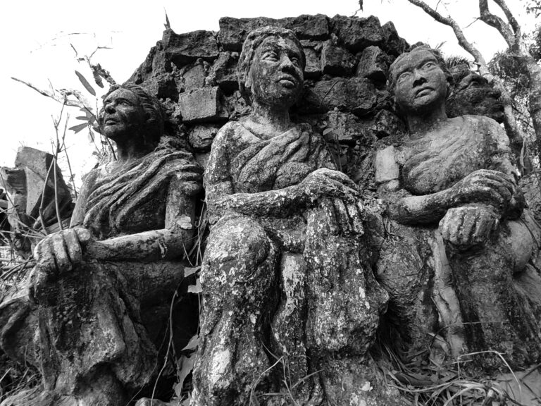 Black and white photo of ancient stone sculptures depicting historical figures. Ancestry DNA Test By EVIDEXA DNA Test Solution Pvt Ltd