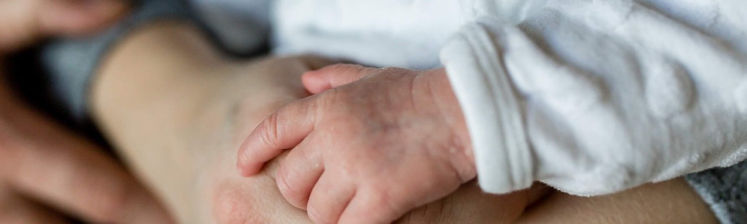 image is showing A father holding hand of his baby Paternity DNA test for peace of mind with father and child DNA testing