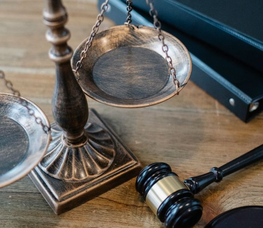 From above of judicial symbols consisting of Scales of Justice and small judge hammer with curly handle of legal dna test by DNA Test Solution